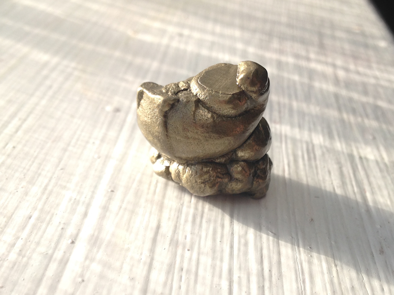 Small pyrite fossilized faeces (golden blob of poop)