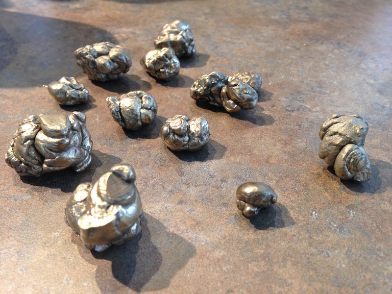 Group of 12 small pyrite fossilized faeces (golden blobs of poop)